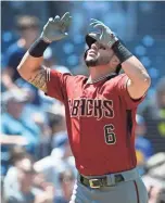  ?? GETTY IMAGES ?? David Peralta points skyward after hitting a solo home run during the third inning Sunday against the Padres.