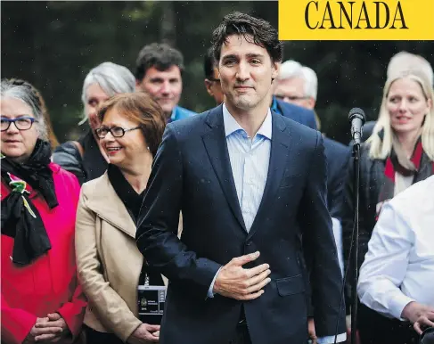  ?? JEFF MCINTOSH / THE CANADIAN PRESS ?? Prime Minister Justin Trudeau speaks to the media with his cabinet at a Liberal party cabinet retreat in Kananaskis, Alta., Sunday.