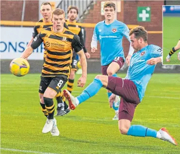  ??  ?? Hearts’ Elliott Frear doubles the visitors’ lead in the closing seconds of the first half.