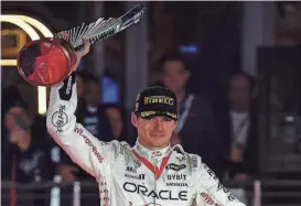  ?? ?? Formula 1 driver Max Verstappen celebrates his victory in the Las Vegas Grand Prix on Nov. 18.