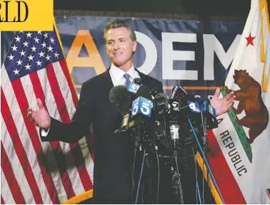  ?? RICH PEDRONCELL­I / THE ASSOCIATED PRESS ?? California Gov. Gavin Newsom addresses reporters at California Democratic Party headquarte­rs in Sacramento
on Tuesday, after handily defeating the Republican-led recall attempt to remove him from office.