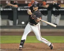  ?? Carlos Avila Gonzalez / The Chronicle ?? Jason Vosler can come off the bench and deliver a big hit for the Giants. Where he stands in the field, that’s anyone’s guess.