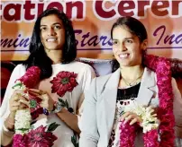  ?? PTI ?? PV Sindhu and Saina Nehwal were felicitate­d by India’s Minister of State for Youth Affairs and Sports Vijay Goel at a function in New Delhi on Thursday. —