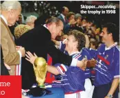  ??  ?? Skipper...receiving the trophy in 1998