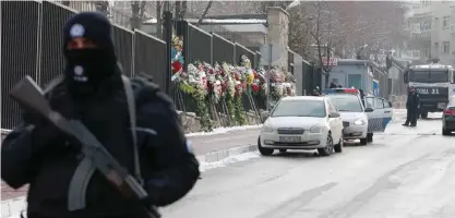  ??  ?? ANKARA: Wreaths are left on the road leading to the Russian embassy in Ankara on December 21, 2016, two days after Russian ambassador to Turkey was gunned down by a Turkish policeman.