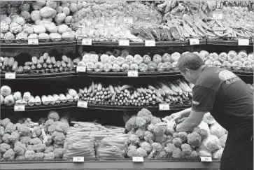  ?? Wally Skalij Los Angeles Times ?? OTHER POTENTIAL BIDDERS for Whole Foods include the parent of the Ralphs and Food4Less chains; Albertsons, which owns Vons and Pavilions; and Wal-Mart Stores. Above, vegetables at a Ralphs store in L.A.