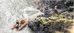  ??  ?? The Aberdeen inshore lifeboat searches cliffs near Findon