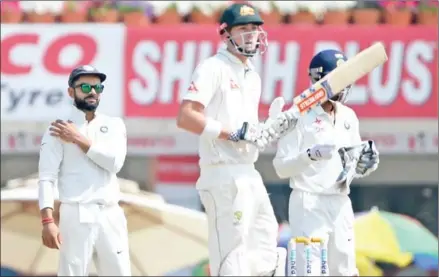  ?? SAJJAD HUSSAIN/AFP ?? India and Australia begin the finale of a bitterly fought Test series on Saturday, with home skipper Virat Kohli (left) keen to silence attacks that even former Wallabies skipper Michael Clarke has warned are ‘getting out of control’.