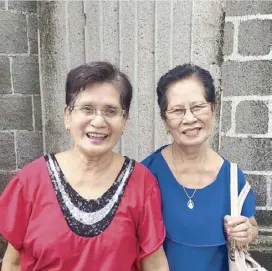  ?? ?? Dinulos sisters Candida Tenorio and Nenita Carasus — during a visit to the Padre Pio shrine in Batangas — are now celebratin­g their sisterhood in heaven.