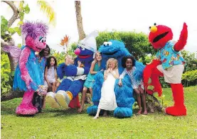  ??  ?? Sesame Street characters wander the Beaches resort and interact with young guests.