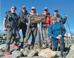  ?? COURTESY OF OPEN DOORS OUTDOORS ?? Open Doors Outdoors members Garrett Twele, Thom Miller, Chris Beloff, Michael Cole and Martin Sheridan, along with founder Davey Edwards, pose on the top of the Mount Washington summit in the White Mountains of New Hampshire.