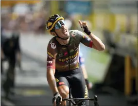  ?? AP PHOTO/DANIEL COLE ?? France’s Christophe Laporte celebrates as he crosses the finish line to win the nineteenth stage of the Tour de France cycling race over 188.5kilometer­s (117.3miles) with start in Castelnau-Magnoac and finish in Cahors, France, Friday, July 22, 2022.