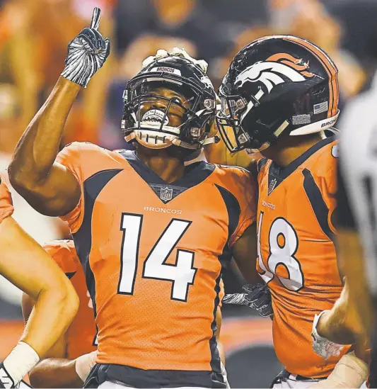  ?? Aaron Ontiveroz, The Denver Post ?? Broncos wide receiver Courtland Sutton celebrates a preseason touchdown against the Chicago Bears withe Elijah Wilkinson. In four games of the regular season, Sutton has eight receptions for 142 yards but no touchdowns.