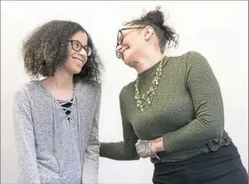  ?? Antonella Crescimben­i/Post-Gazette ?? Annie Corbin, right, shares a moment with her daughter, Arianne, on Monday while watching a promotiona­l video for the new Solevo Wellness center in Squirrel Hill. The video features Arianne.