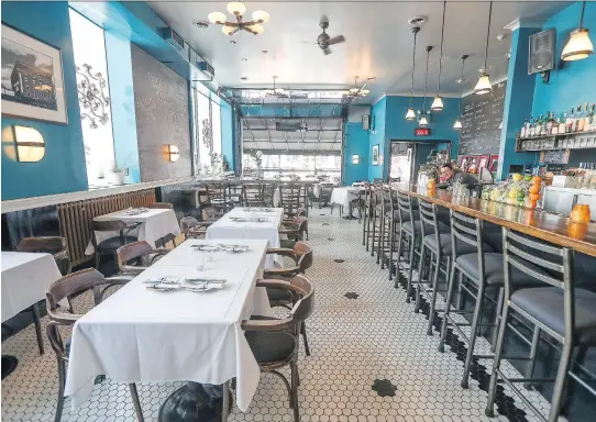  ?? PHOTOS: JOHN MAHONEY ?? The Monkland Tavern was renovated last year and now features a black and white tile floor and antique light fixtures.