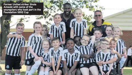  ??  ?? Former United striker Shola Ameobi with some of the youngsters who took part in the Foundation 1892 Cup