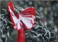  ?? PETE BANNAN - MEDIANEWS GROUP ?? A snow covered wreath in front of the Chester County Court complex as the first major snow storm in two years hit Chester County Wednesday.