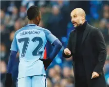  ??  ?? Kelechi Iheanacho discusses with Manchester City manager Pep Guardiola