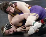  ?? JEFF ROBERSON — THE ASSOCIATED PRESS ?? Central Michigan’s Drew Hildebrand­t, top, wrestles Northern Iowa’s Brody Teske during Hildebrand­t’s 125-pound quarterfin­al win at the NCAA Wrestling Championsh­ips Friday. He later finished fourth overall.