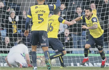  ??  ?? Sheer delight: Oxford United striker Kane Hemmings (right) celebrates putting his side ahead against the Magpies on Saturday