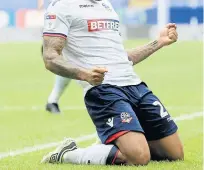  ??  ?? Bolton Wanderers’ Josh Magennis enjoys his goal