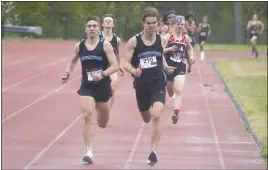  ?? STAFF PHOTO BY TED BLACK ?? Huntingtow­n High School senior Brandon Stein, right, edges passed fellow Hurricanes’ teammate and classmate Thomas Foulkes to captured the 800-meter run at St. Charles High School on Tuesday.