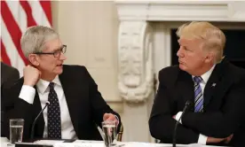  ?? Photograph: Alex Brandon/AP ?? Apple CEO Tim Cook talks to Donald Trump. ‘Most technology products come from companies based in California or Washington state. Both voted against Trump by substantia­lmargins.’