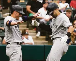  ?? Nam Y. Huh / Associated Press ?? The Yankees’ Joey Gallo, right, celebrates with Josh Donaldson after hitting a two-run home run against the White Sox in the ninth inning on Sunday.