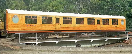  ?? ?? Earlier this year, the sole-surviving Thompson third corridor No. 1623 benefitted from having the ‘scumble’ (wood effect) livery refreshed, pictured here on the turntable at Pickering after outshoppin­g from the Atkins shed. By no means a simple task, it took several weeks and entailed grinding out screws where the filler cap had ‘popped’ through the surface of the paint and replacing them with a longer stainless steel screw. The mustard colour base coat was applied to a rubbed-down surface and the scumble coats applied after. MURRAY BROWN