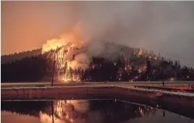  ?? ETHAN SWOPE/AP ?? Flames from the Dixie Fire, which has scorched nearly 1 million acres, spread in Genesee, Calif., on Aug. 21.