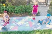  ?? KARLEE KUNKLE/COURTESY PHOTO ?? Organized by residents of Lake Nona’s Laureate Park neighborho­od, this colorful community activity encourages families to decorate their portion of the sidewalk with doodles, designs, obstacle courses and encouragin­g messages for their fellow neighbors.