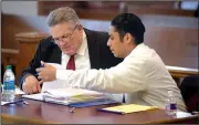  ?? NWA Democrat-Gazette/ANDY SHUPE ?? Giovanni Vasquez-Sanchez (right) speaks Wednesday with Fayettevil­le attorney Erwin Davis during Vasquez-Sanchez’s trial at the Washington County Courthouse in Fayettevil­le.