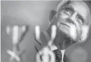  ?? Ray Whitehouse / San Antonio Express-News ?? D-Day veteran William C. Scott stands for a portrait with the three medals he received for his service: a Bronze Star, Purple Heart and Good Conduct Medal.