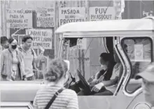  ?? ?? Posters showing sentiments of jeepney drivers against the government’s public utility vehicle modernizat­ion program are displayed in a transport terminal in Manila on Monday, Jan. 16, 2024.