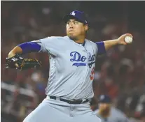  ?? WILL NEWTON/GETTY IMAGES FILES ?? Hyun-jin Ryu is expected to lead the Toronto Blue Jays pitching staff after signing Sunday with the club.