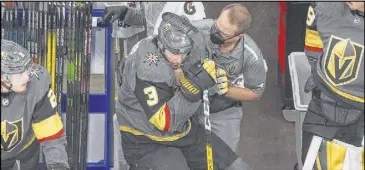  ?? Jason Franson The Associated Press ?? After blocking a shot and feeling it during the second period of Game 7, Knights defenseman and penalty-killing specialist Brayden McNabb receives some treatment.