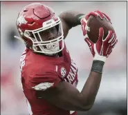  ?? (NWA Democrat-Gazette/Charlie Kaijo) ?? Sophomore wide receiver Treylon Burks had 51 catches for 820 yards and 7 touchdowns for the Razorbacks this season. Arkansas, which had a 64.4% completion rate, ranked 24th in team passing efficiency.