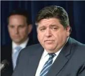  ?? TYLER LARIVIERE/SUN-TIMES ?? Gov. J.B. Pritzker and state health officials give their daily update on the coronaviru­s situation in Illinois on Thursday.