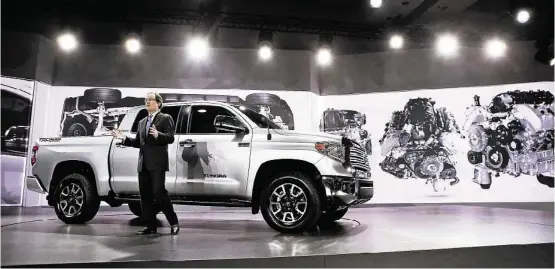  ?? Scott Olson / Getty Images ?? Bill Fay, Toyota’s group vice president and general manager, introduces the 2014 Tundra full-size truck at the Chicago Auto Show on Thursday.