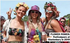  ?? ?? FLOWER POWER:
Festivalgo­ers at Glastonbur­y in 2019
