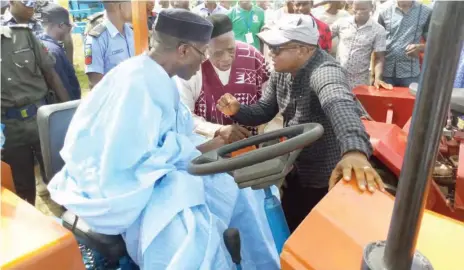  ??  ?? Chie Audu Ogbeh, Minister of Agricultur­e on made in Nigeria mini tractor at the Agric Show