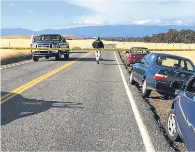  ??  ?? SEALED: Tape blocks off the road leading into Rancho Tehama in California, following the fatal shootings