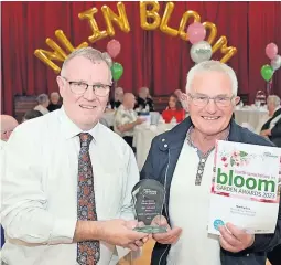  ?? ?? Flower power Councillor Michael McPake (left), and 2023’s overall In Bloom award winner Tommy Ellis, from Airdrie