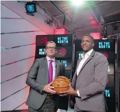  ?? — THE CANADIAN PRESS ?? Nick Nurse, left, was introduced as the new head coach of the Toronto Raptors by team president Masai Ujiri in Toronto on Thursday.