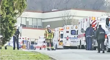  ??  ?? Emergency vehicles are seen outside of Franklin Regional High School after reports of stabbing injuries. — Reuters photo