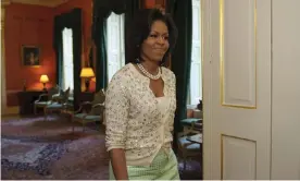  ?? Photograph: Mandel Ngan/AFP via Getty Images ?? Michelle Obama wearing a cardigan at 10 Downing Street in 2009.