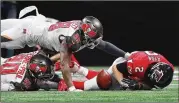  ?? CURTIS COMPTON / CCOMPTON@AJC.COM ?? Matt Ryan fumbles in the midst of one of the six sacks he endured Sunday.