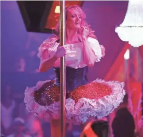  ??  ?? Stormy Daniels performs at a Florida strip club March 9. Watchdog groups say an alleged “hush” payment to Daniels in October 2016 to stay quiet about an affair with Donald Trump raises “a number of red flags.”
