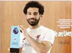  ??  ?? PREMIER LEAGUE Liverpool’s Mohamed Salah poses for a photo with his Premier League Player of the Season trophy on May 13, 2018.