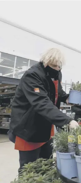  ??  ?? 0 Prime Minister Boris Johnson chooses a plant as he visits the garden centre in the B&Q store in Middlesbro­ugh. As restrictio­ns continue to ease in England